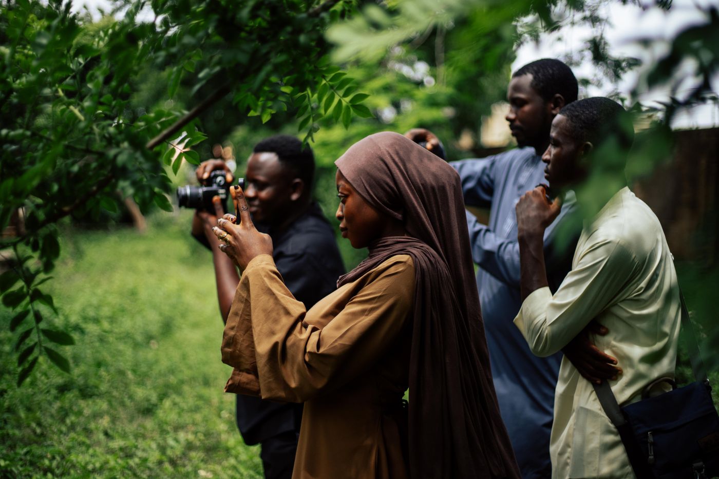 People outdoors during a photography workshop.